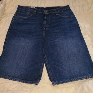 Nuevo Levi's 569 PANTALONES CORTOS 34 Sueltos Rectos Jean Denim Lavado Oscuro Hombres (Mark Pocket) - Imagen 1 de 7