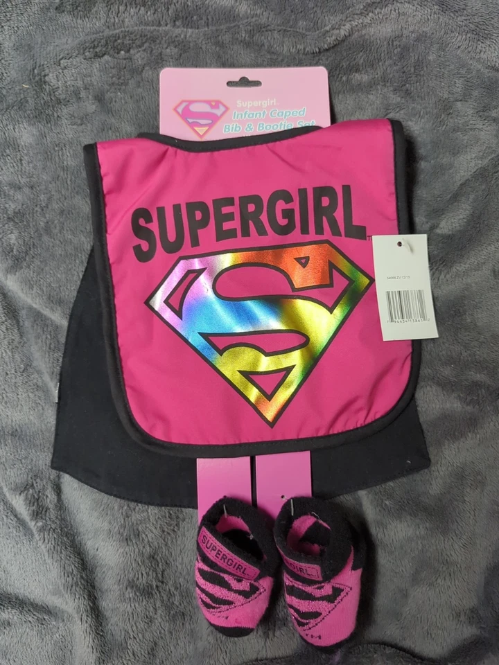 DC Supergirl Bebé Con Capa Babero y Botín Conjunto Recién Nacido Bebé Niña Nuevo Foto 1 de 4