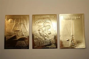 Juego de 3 CARTELES DE PELÍCULAS DE STAR WARS 23KT Tarjetas de Oro IMPERIO/JEDI/ORIGINAL - Imagen 1 de 1