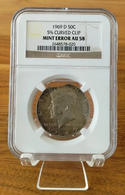1969 D - Kennedy Half Dollar - AU58 - 5% Curved Clip - Mint Error - Image 1 of 2