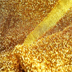 OROPEL BRILLANTE Lurex material de tela /150 cm de ancho / brillo dorado brillante - Imagen 1 de 3