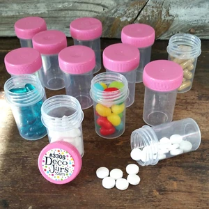 Pequeñas botellas de píldoras de plástico 12 frascos contenedores CAPS rosa #3308 DecoJars EE. UU. - Imagen 1 de 4