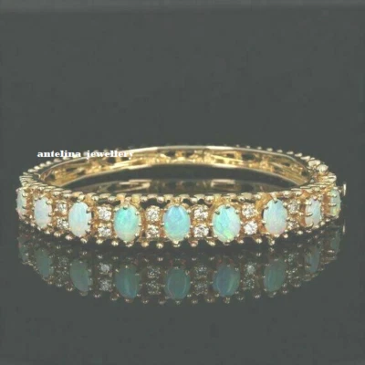12 Ct Oval Lab-Created Fire Opal 7.25" Bangle Bracelet 14K Yellow Gold Plated - Image 1 of 4