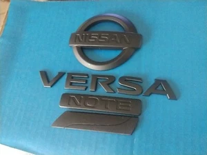 NISSAN VERSA BLACK LETTERING EMBLEMS WITH NOTE AND PURE DRIVE LOGO OEM USED  - Picture 1 of 6