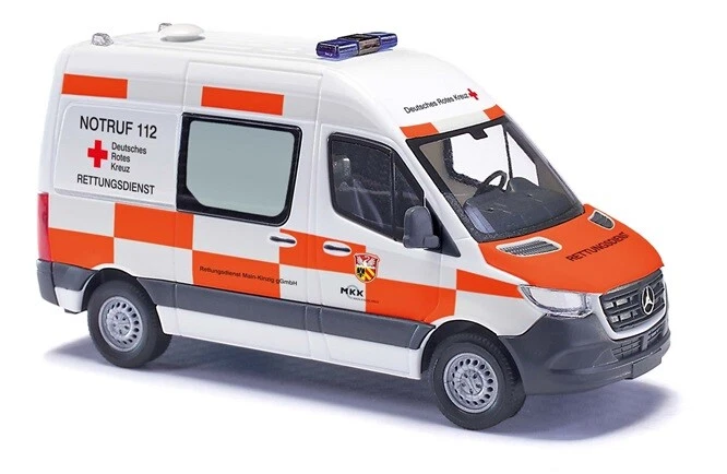 Busch 54005 - H0 - Mercedes-Benz Sprinter Corto Tetto Alto DRK Main-Kinzig-Kreis - Immagine 1 di 1