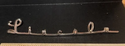 EMBLEMA DE LUXO LINCOLN 1951 COSMOPOLITA GENUÍNO 7 polegadas de comprimento - Imagem 1 de 4