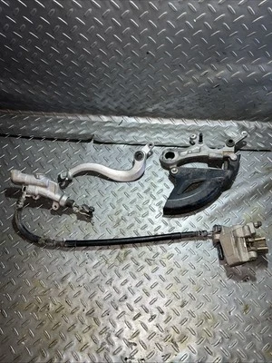 2006-2020 Yamaha YZ450FX YZ250FX WR250F WR450F Pinza de freno trasera de stock OEM Foto 1 de 4