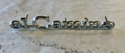 Chevrolet El Camino 1968-1969 emblema de cabezal delantero GM NOS C15 Foto 1 de 2