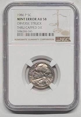 1986 AU58 Nickel with Major Mint Error Struck through capped die - Image 1 of 2