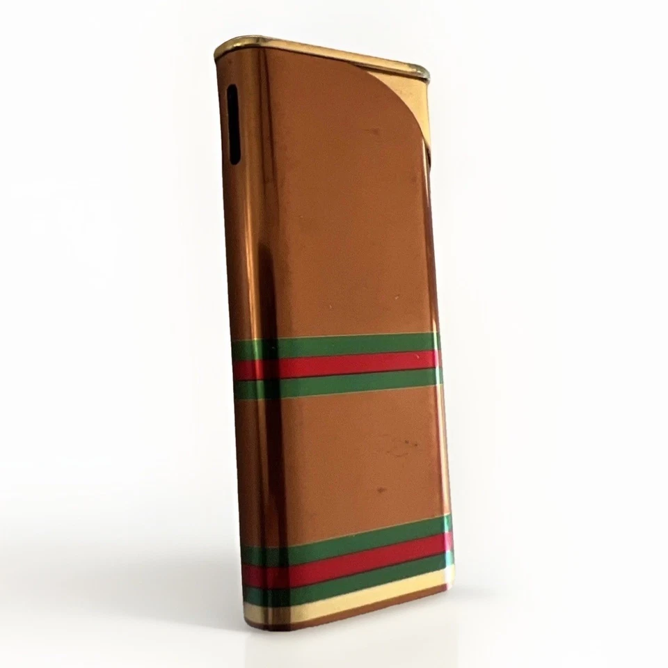 Encendedor de gas Gucci vintage GG monograma marrón dorado líneas de jerez Foto 1 de 4