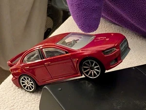 AWESOME 2007 MITSUBISHI LANCER EVOLUTION W SPOILER CHERRY RED 1:64 SCALE HW NOC - Picture 1 of 20