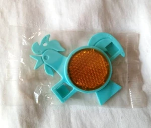 VINTAGE COLLECTABLE 1989 KELLOGGS CORN FLAKES BIKE SPOKE REFLECTOR TURQUOISE NEW - Foto 1 di 1