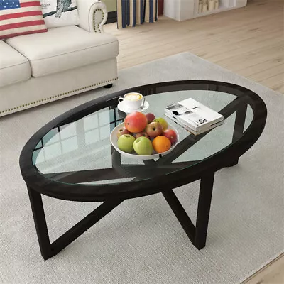 Mesa de centro moderna con base de madera negra y tapa de vidrio templado ovalado para sala de estar Foto 1 de 4