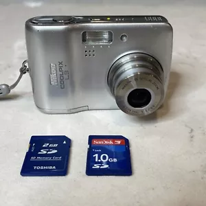 Nikon Coolpix L3 5.1MP Digital Camera Silver 3x Zoom TESTED w 3 SD CARDS!!! - Picture 1 of 16