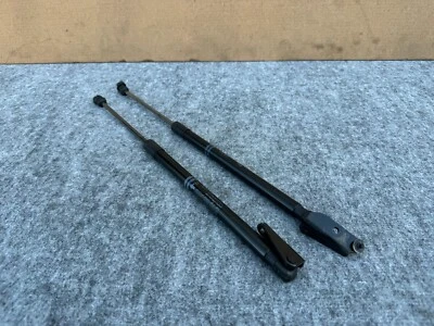 NISSAN 370Z CUPÉ 2009-2021 OEM PUERTA LEVADIZA MALETERO AMORTIGUADORES PUNTALES (PAR) Foto 1 de 4