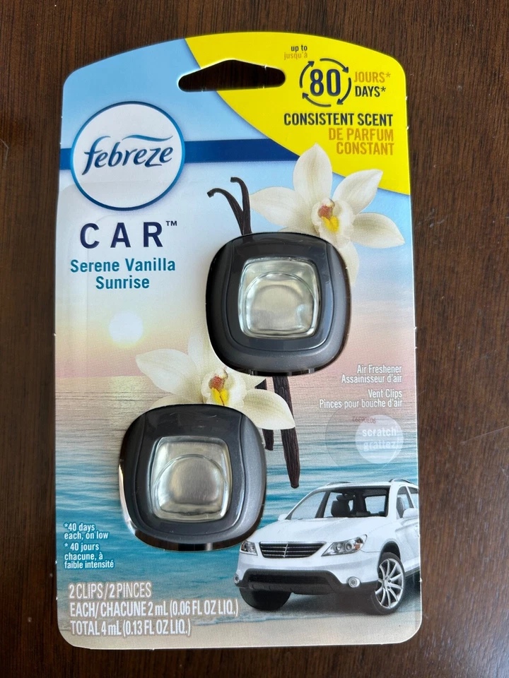Paquete de 2 clips de ventilación para automóvil Febreeze ambientadores Serene Vanilla Sunrise Foto 1 de 1