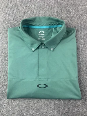 Polo de golf Oakley Hydrolix de manga corta para hombre talla L verde Foto 1 de 4