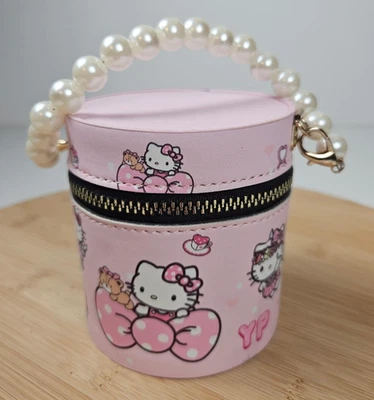 Estuche redondo temático Hello Kitty monedero mango perlado y variedad brillo de labios 20 piezas Foto 1 de 4
