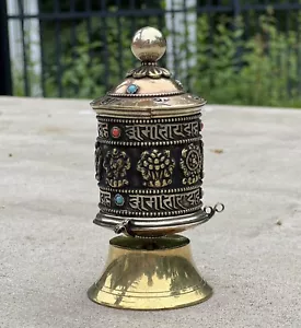 Ruota di preghiera buddista da tavolo tibetana 8 simboli fortunati - Foto 1 di 6