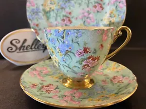 Shelley MELODY CHINTZ TAZZA, PIATTINO E PIATTO 8" RIPON CON PIEDINI - BORDO ORO - Foto 1 di 7