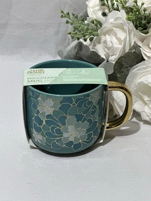 Nueva taza de gres verde azulado y dorado diseño suculento de tomillo y mesa 16 oz. Foto 1 de 4