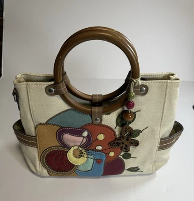 Cartera de lona con apliques florales con asa de acrílico Foto 1 de 4