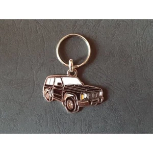 Porte-clés profil Nissan Patrol Y60 GR GQ, Ford Maverick (noir) - Foto 1 di 1