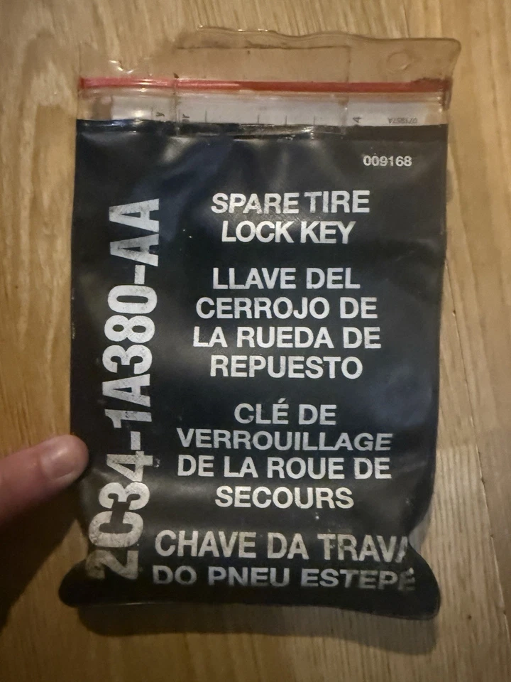 Neumático de repuesto para llave de bloqueo Ford Super Duty 2004 F250 F350 2C34-1A380-AA tarjeta de código OEM Foto 1 de 4