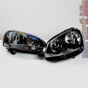 Hella Klarglas Scheinwerfer Set VW Golf 5 V GTI R32 schwarz inkl. Stellmotoren - Picture 1 of 1