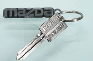 VINTAGE MAZDA KEY FOB WITH UNCUT BRANDED KEY! 1980'S EXTREMELY RARE! FROM MAZDA - Picture 1 of 2