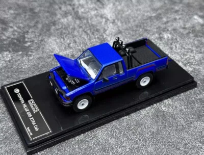 GCD 1:64 Toyota Hilux Pickup Truck Metal Diecast Model Car Open Blue/White/Gray - Immagine 1 di 4