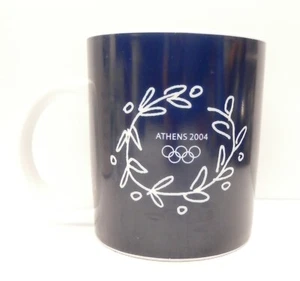 Taza de café de los Juegos Olímpicos de Atenas 2004 azul oscuro y blanco con corona de rama de oliva - Imagen 1 de 4