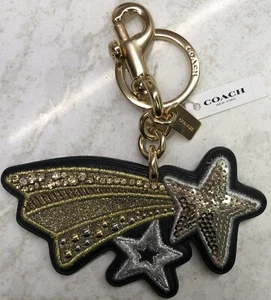 NEU MIT ETIKETT COACH STERNSCHNUPPE PAILLETTEN KRISTALL VERZIERT SIG TASCHENANHÄNGER GOLD 39610 - Bild 1 von 4