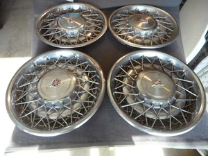 1975-1985 Cadillac DeVille Seville Fleetwood 15" Wire/spoke Hubcaps (4) - 4parts - Picture 1 of 18