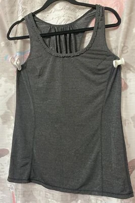 Camiseta sin mangas LULULEMON espalda cruzada talla 6 gris a cuadros tejido ligero plisado espalda Foto 1 de 4