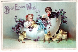 ANTIQUE EASTER Postcard YOUNG GIRL AND BOY SITTING IN EGG SHELL, CHICKS - Picture 1 of 2