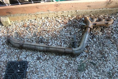 84-85 TOYOTA SUPRA OEM EXHAUST MANIFOLD, O2 SENSOR, DOWN PIPE WITH HEATSHIELDS - Image 1 of 4