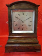 Mid 19th century figured rosewood fusee library clock of small proportions