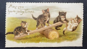 VICTORIAN GREETING CARD 4 CATS KITTENS PLAYING ON WOODEN SEE SAW - Picture 1 of 2