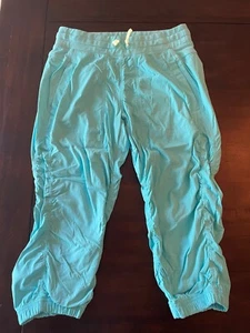 IVIVVA Lululemon Teal Live to Move Crop Pants Girls Youth Size 14 - Picture 1 of 3