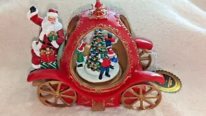 Carro musical de Santa FAO Schwarz con niños y luces, escena de árbol giratorio Navidad - Imagen 1 de 8