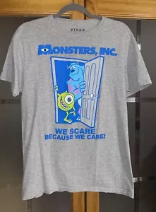 Monsters, Inc. We Scare Because We Care Disney Pixar Para hombres Gris Medio Cuello Redondo - Imagen 1 de 2