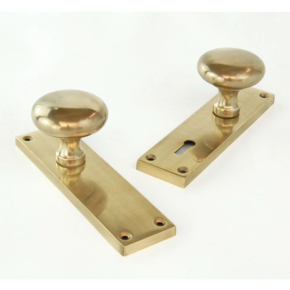 Aged Unlacquered Solid Brass New York Round Door Knobs Handles on Long Backplate - Image 1 of 1