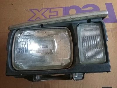 1986 Nissan 300ZX right side passenger Head Light Assembly Bucket w/bezel - Image 1 of 3