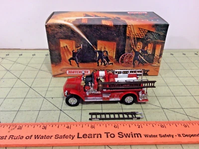 Camión de bomberos Matchbox serie YFE01 1920 Mack AC nuevo en caja Foto 1 de 4