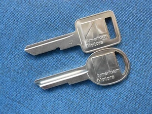 2 AMC LOGO Jeep Wrangler Cherokee Comanchee NOS KEY BLANKS 1985 - 1990 - Picture 1 of 2