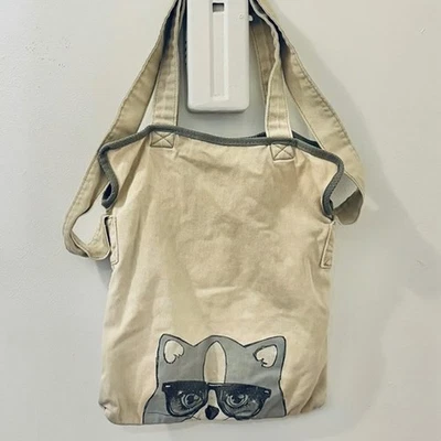 Bolsa tote gato com óculos BCBGeneration tecido bege desgastado - Imagem 1 de 4