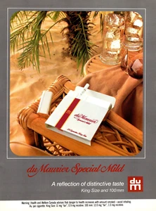 Anuncio impreso 1984 du Maurier especial cigarrillos suaves silla de ratán en la playa 8" x 11" - Imagen 1 de 1