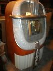 Vintage 1946 AMI "mother of plastic" jukebox with platters to play 45