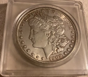 Morgan Dollars. 1902 O, 1921, 1900 O, 1892 O - Picture 1 of 8